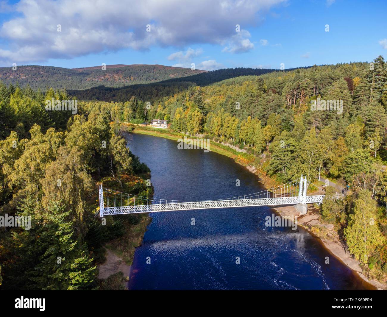 Aerial drone picture of Cambus O' May suspension bridge over the River Dee near ballater in Royal Deeside, Aberdeenshire, Scotland Stock Photo