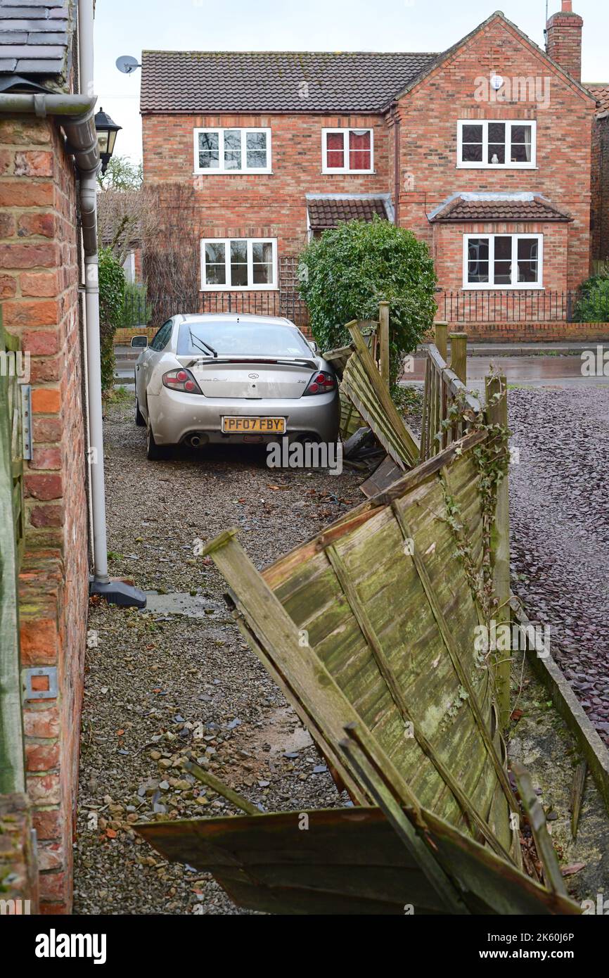 garden fence blown down on car after storm Arwen york yorkshire united kingdom Stock Photo