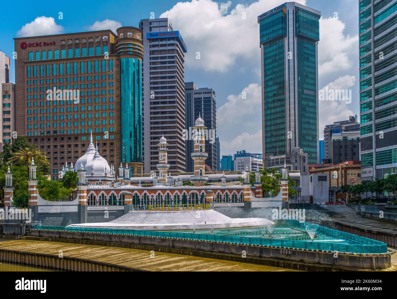 Kuala Lumpur, Malaysia - February 4th 2018: The Jamek Mosque located between the Klang River and Gombak River overlooked by skyscrapers. Stock Photo