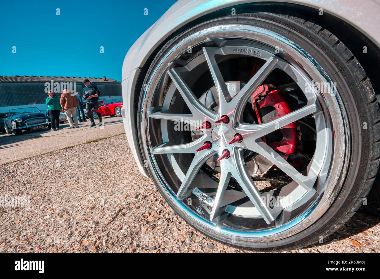 Hot wheels, spiked wheel nuts on a custom car at Rawles Motorsport in Hampshire, England Stock Photo