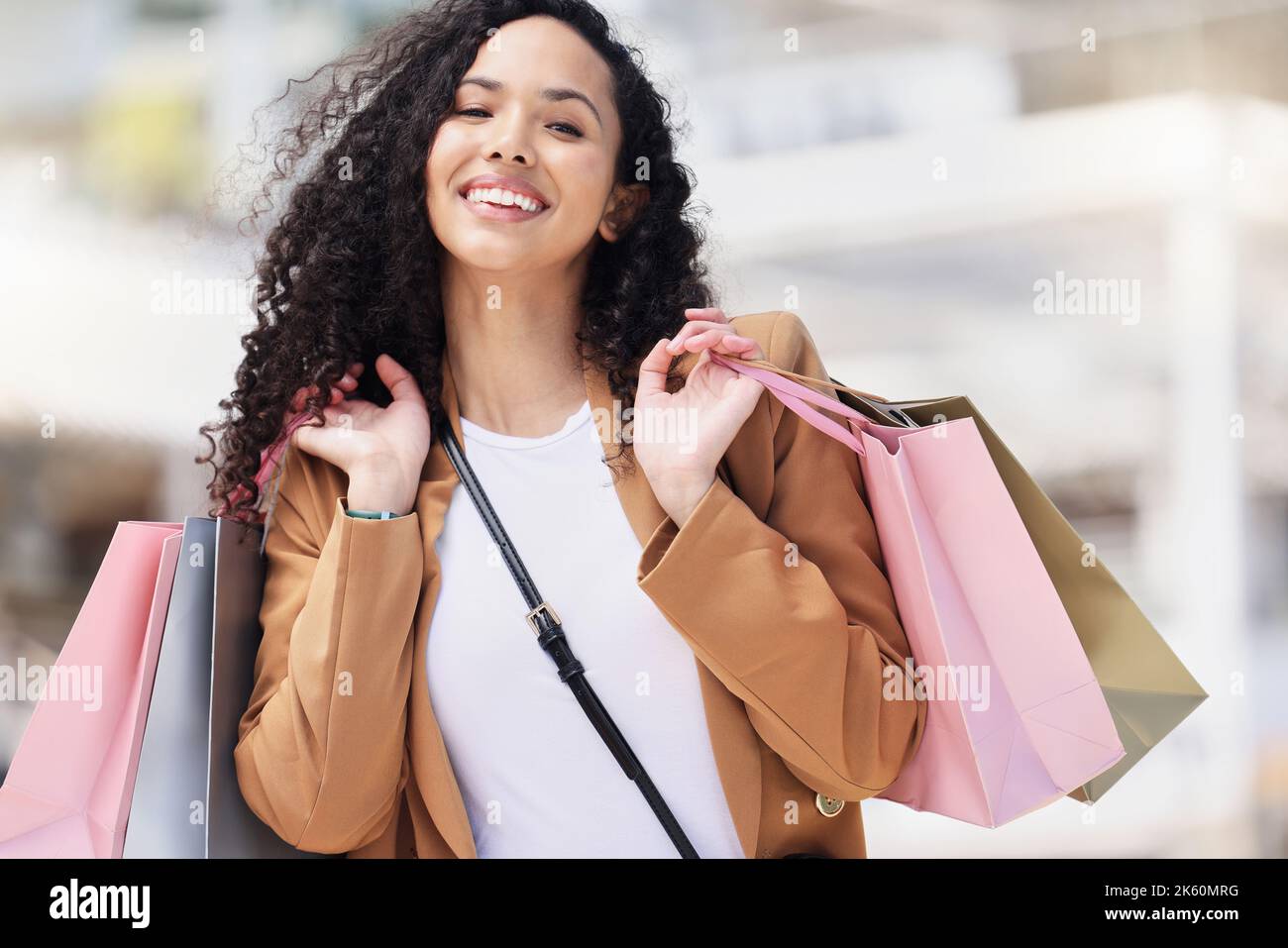 Woman client, customer and shopping with bags smile, happy and confident with purchase clothes and items from store. Female consumer, relax and doing Stock Photo