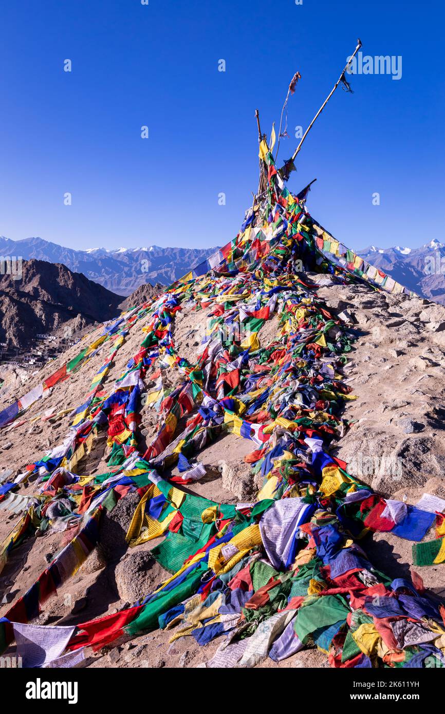 Buddhist prayer flags with Leh in the background, Leh, Ladakh, India Stock Photo