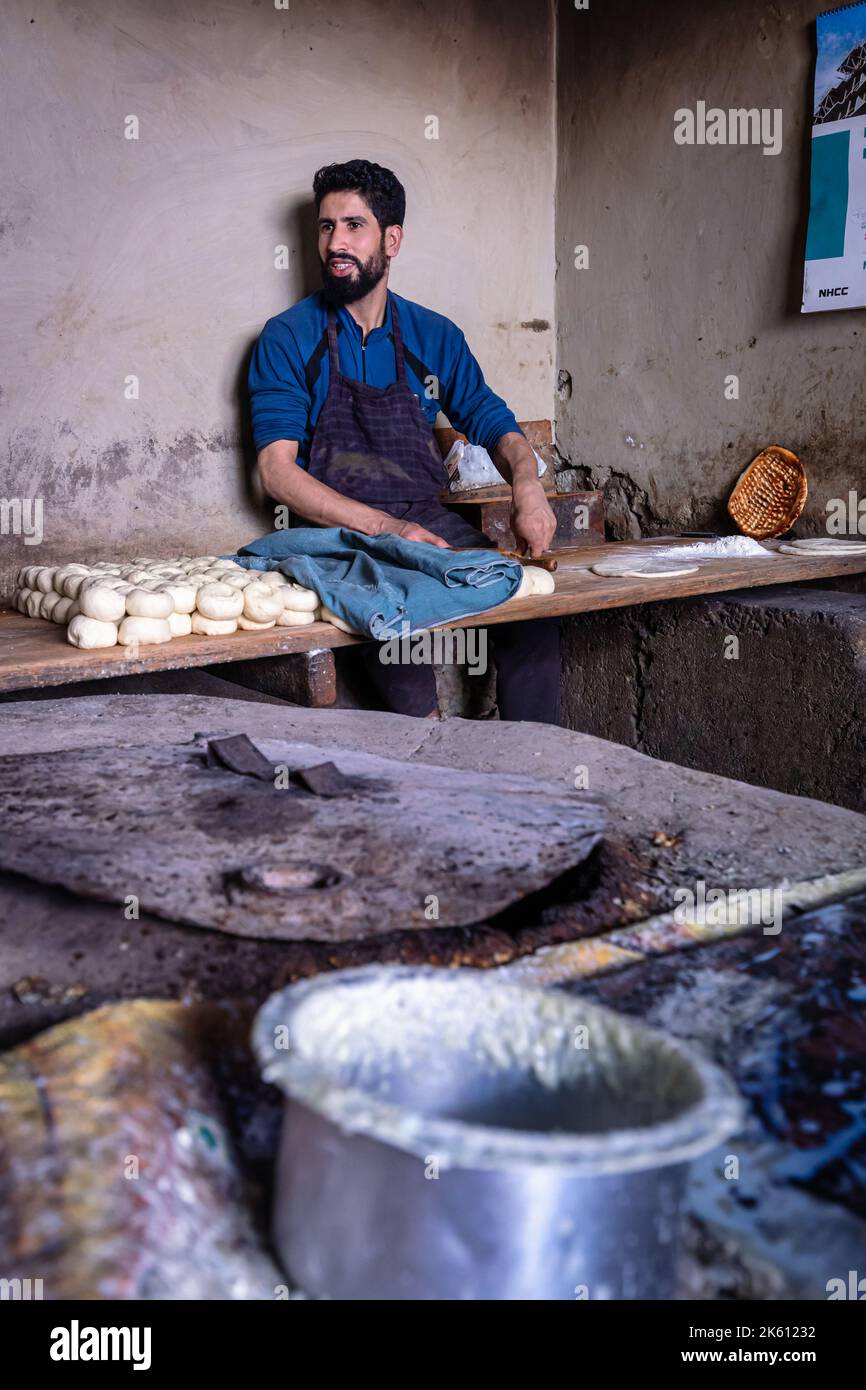 A man preparing dough for bread in Leh, Ladakh, India Stock Photo