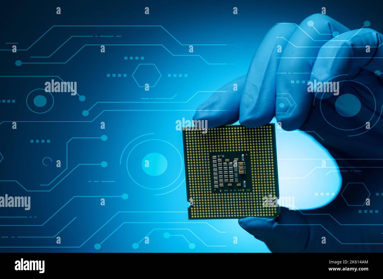 Electronic engineer hand holding computer chip on blue background