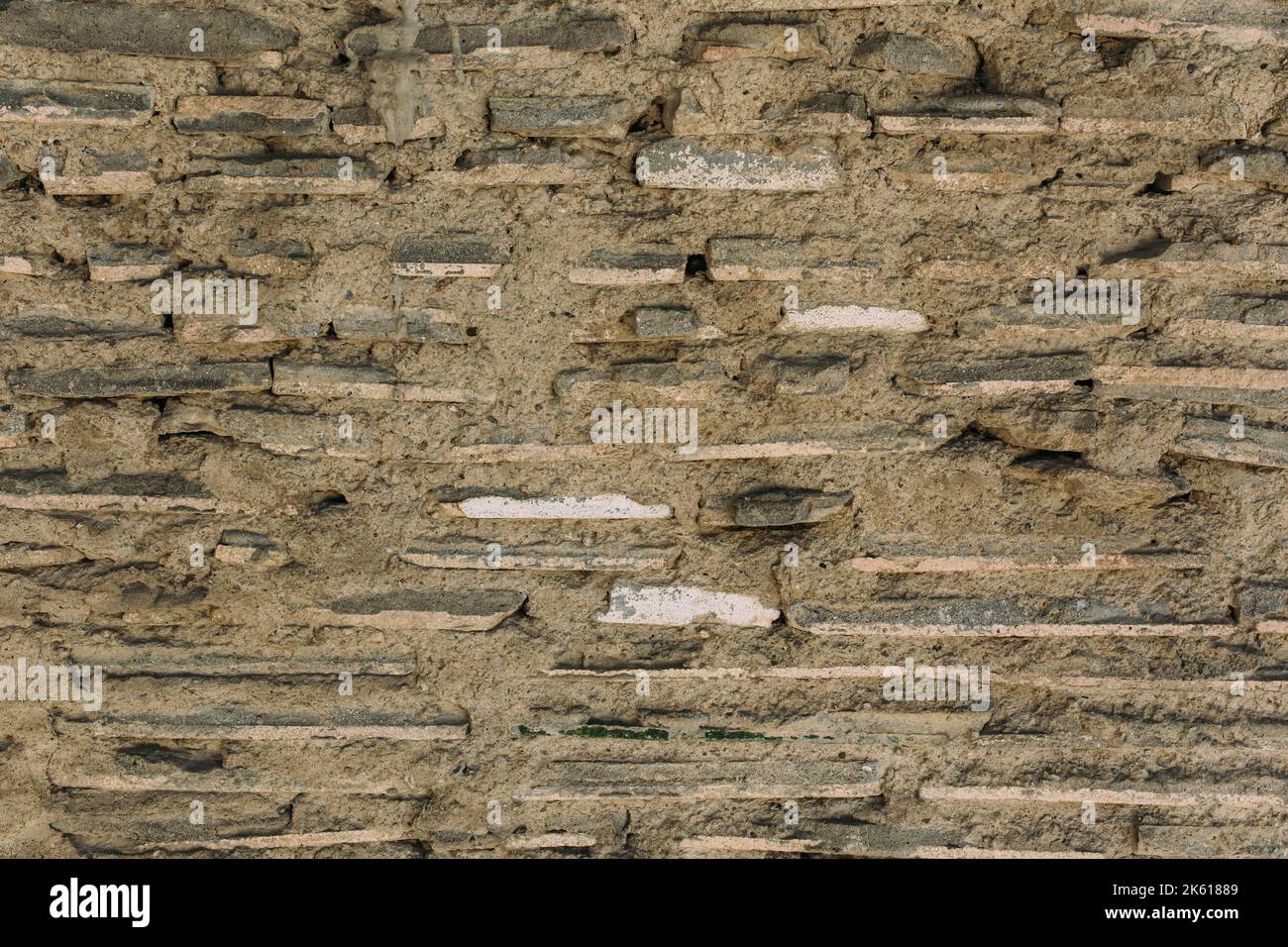 Old stone wall texture, cement, plaster. Background Stock Photo