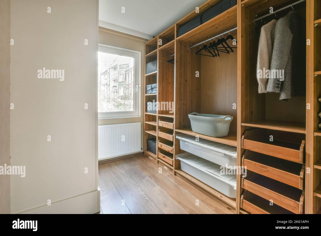 Interior of a dressing room of a modern house with clean and folded