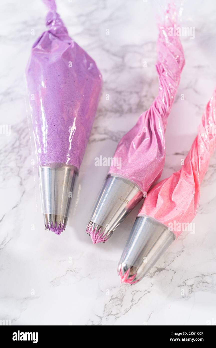 Mini Vanilla Cupcakes with Pink Buttercream Frosting Stock Photo - Alamy