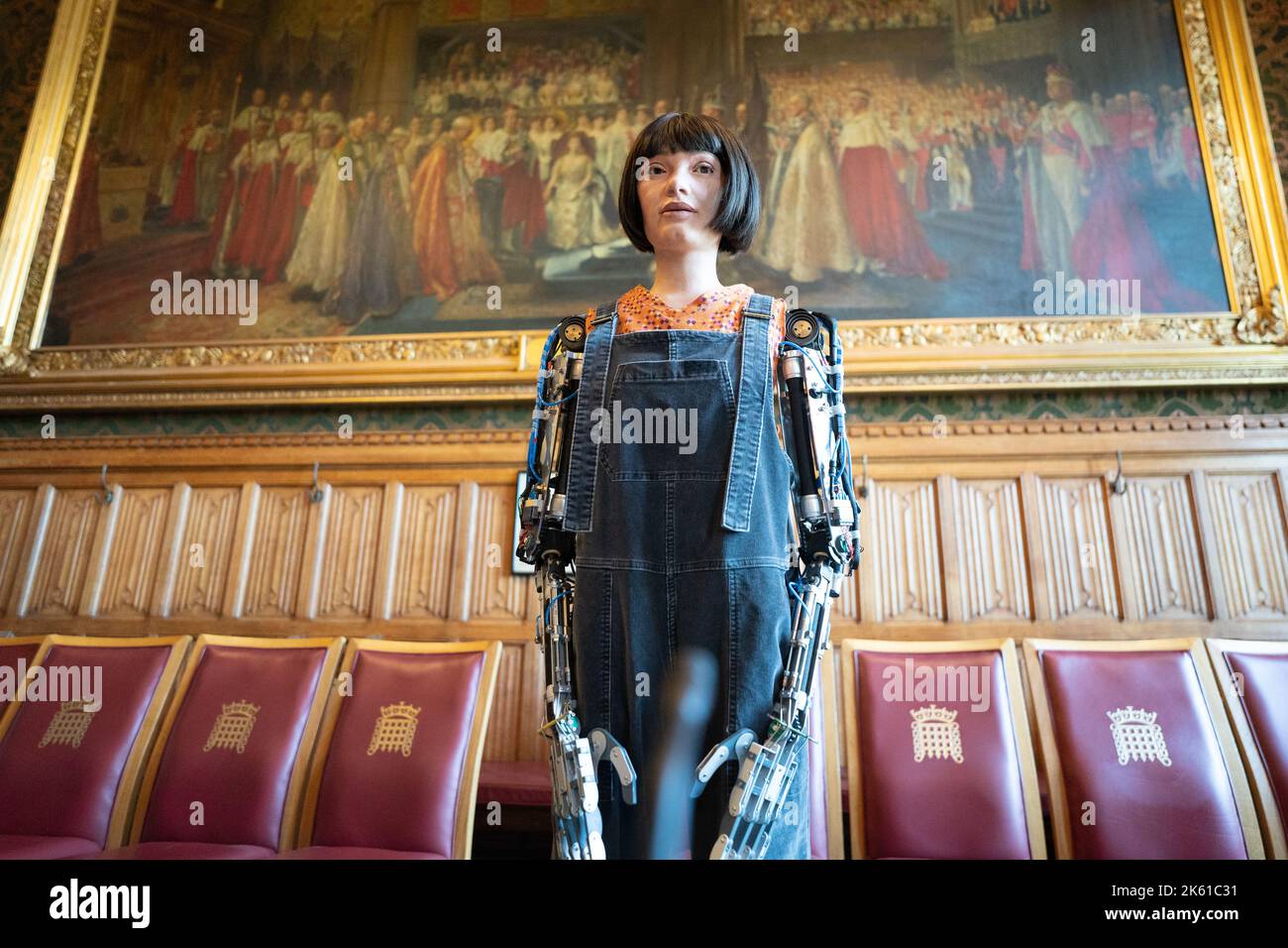 Ai-Da Robot poses for pictures in the Houses of Parliament in London before making history as the first robot to speak at the House of Lords. AI-Da Robot’s maiden speech will explore the role of machine learning, machine creativity and Artificial Intelligence within the UK’s creative industries. Picture date: Tuesday October 11, 2022. Stock Photo