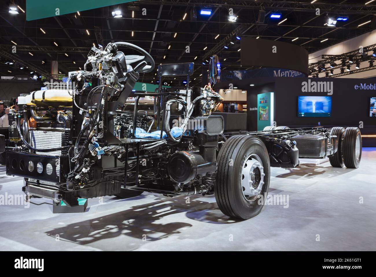Exposed chassis, engine, gears and motor of a MercedesBenz bus on display at the LAT.BUS 2022