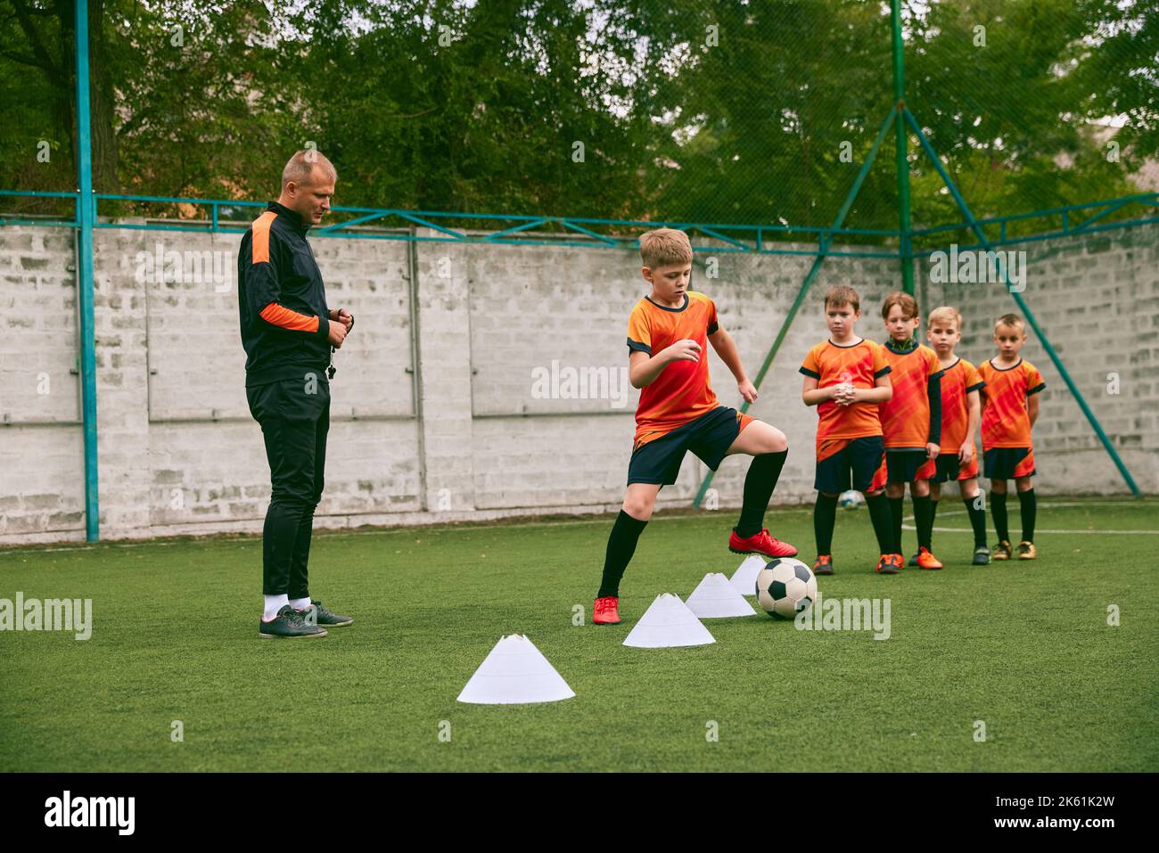 Sport training with coach. Preparing for sport competition. Beginner