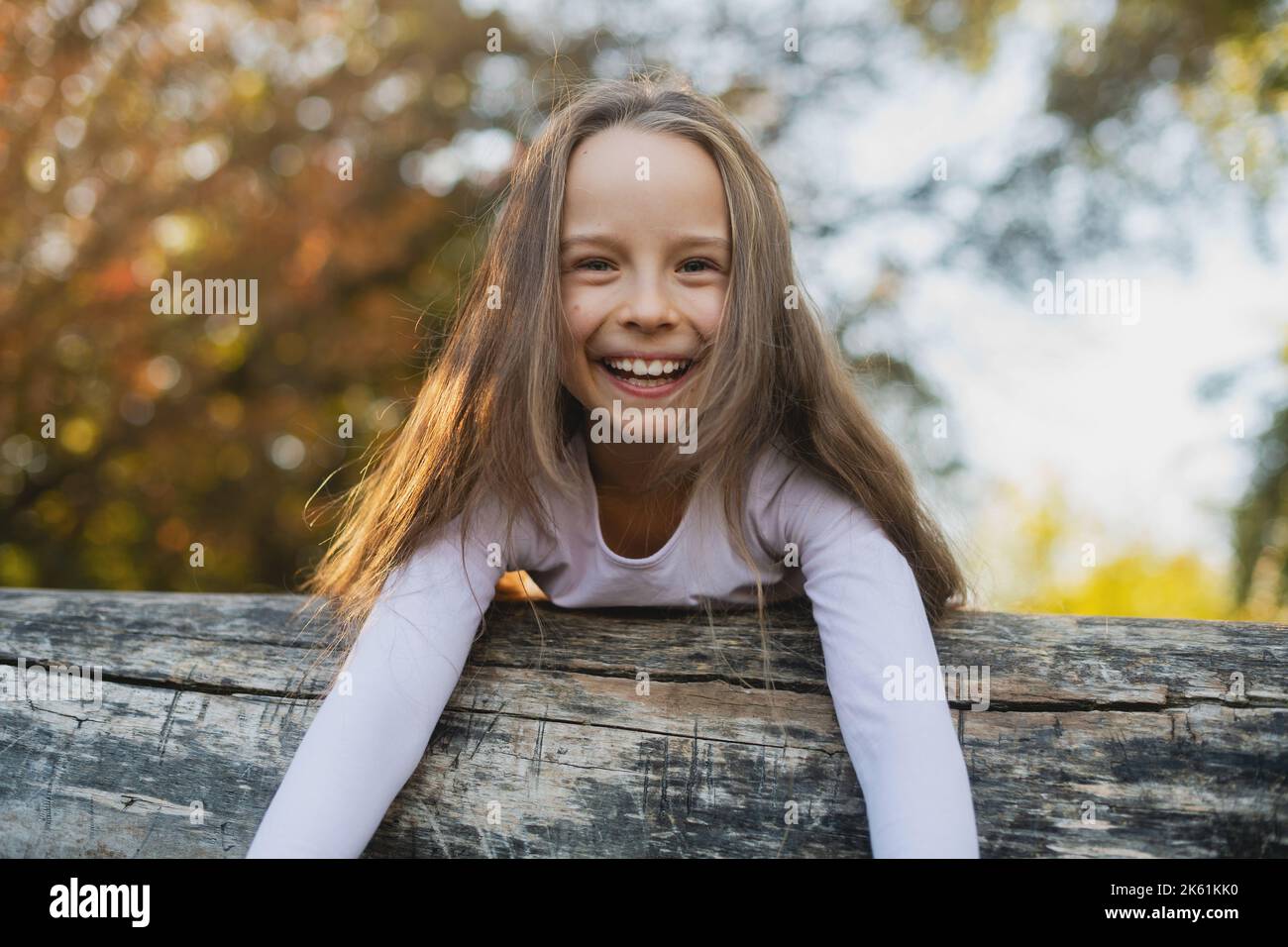 Kids and Sport. Side View of a Happy Little Girl Smiling at Camera