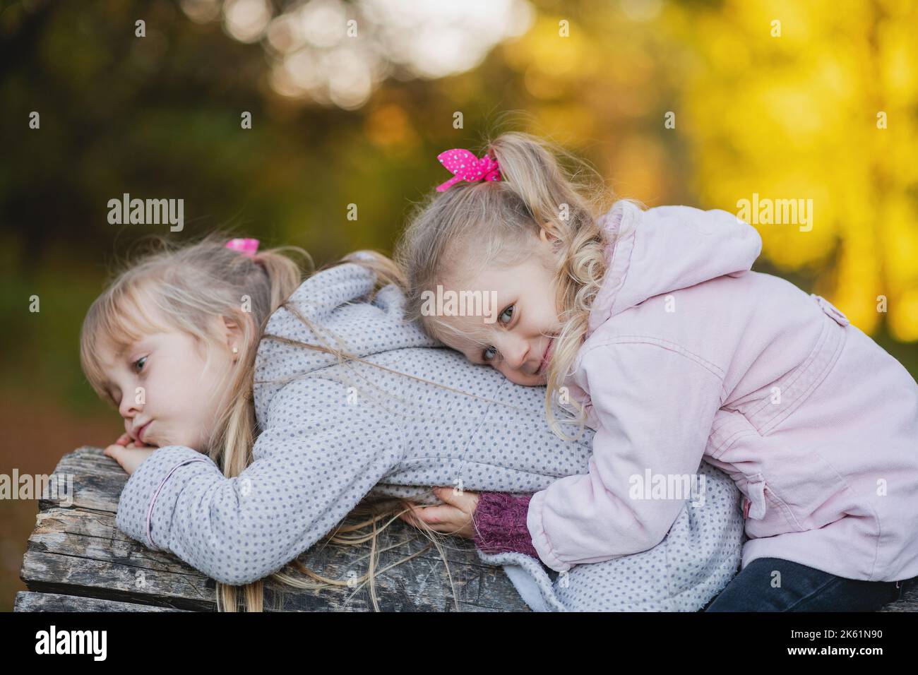 Two girls lean back back hi-res stock photography and images - Alamy