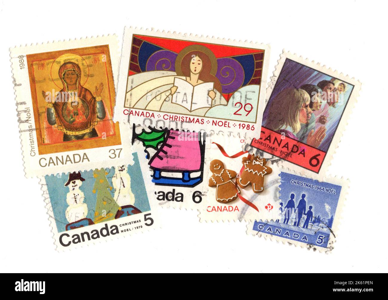 A montage of vintage Christmas stamps from Canada on a white background. Stock Photo