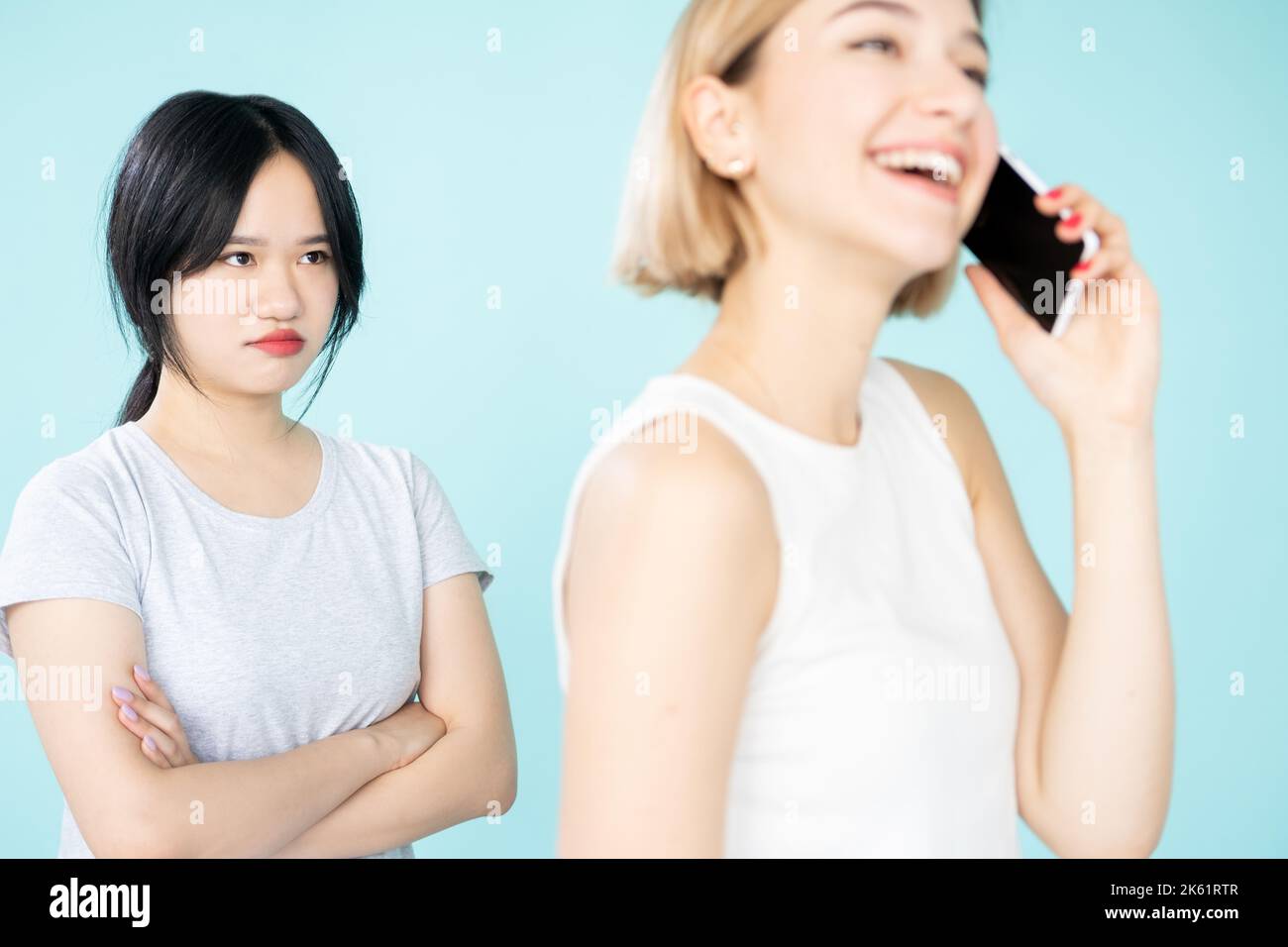 female friendship jealousy relationship ethnic Stock Photo