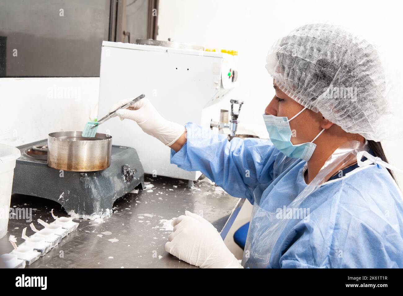Scientist embedding tissues in paraffin blocks for sectioning. Pathology laboratory. Cancer diagnosis. Stock Photo