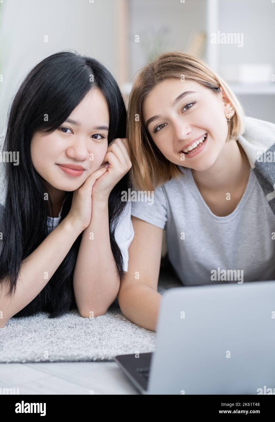 friendly homework happy teenage girls ethnic Stock Photo