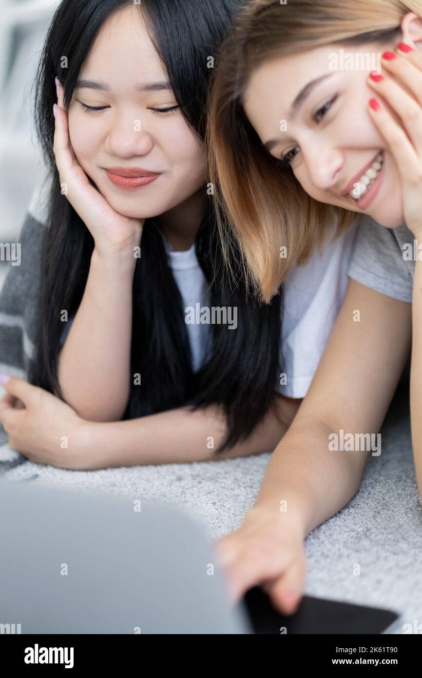best friends happy women enjoying time home movie Stock Photo