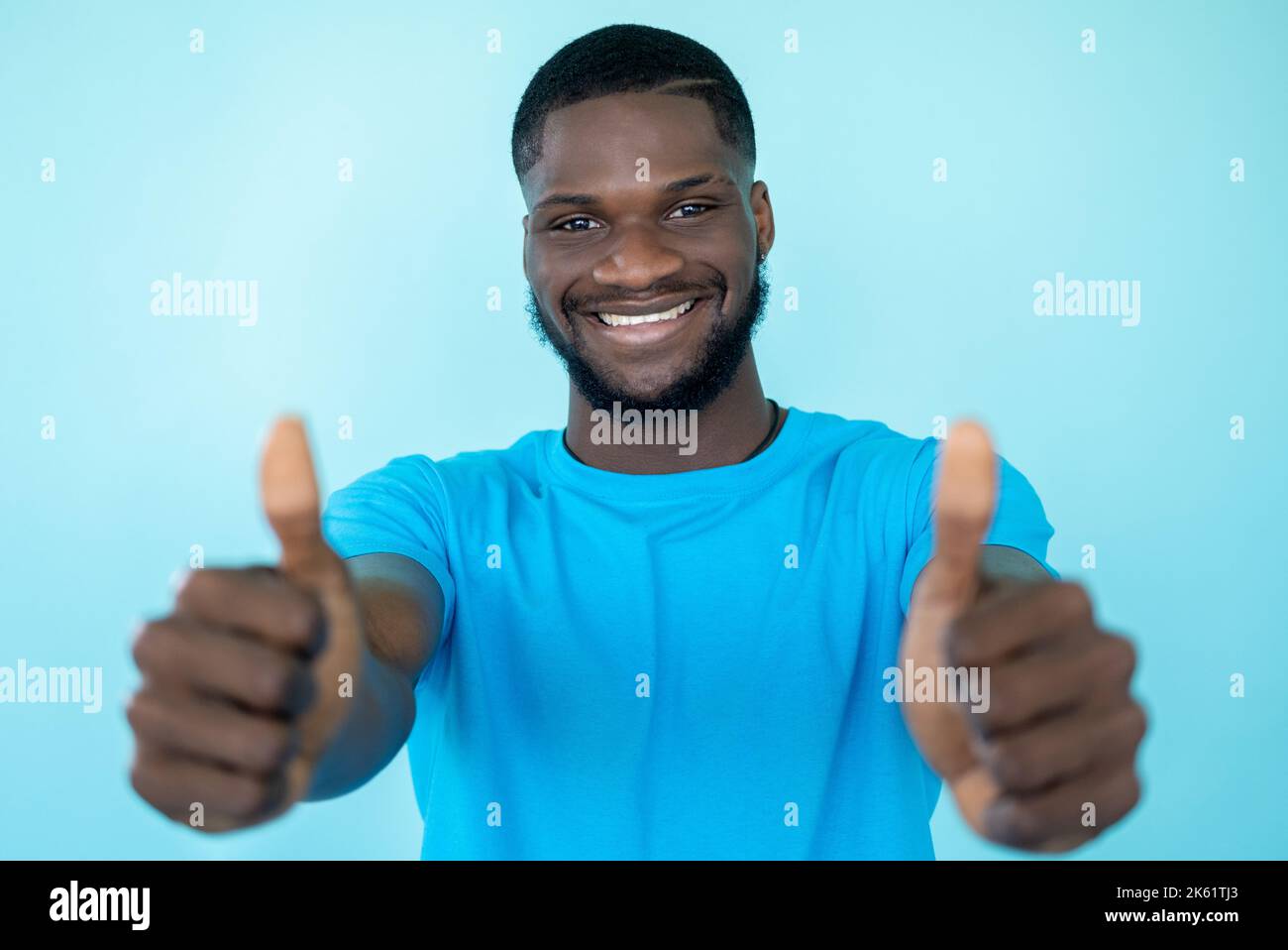 approval gesture agree sign joyful man thumbs up Stock Photo