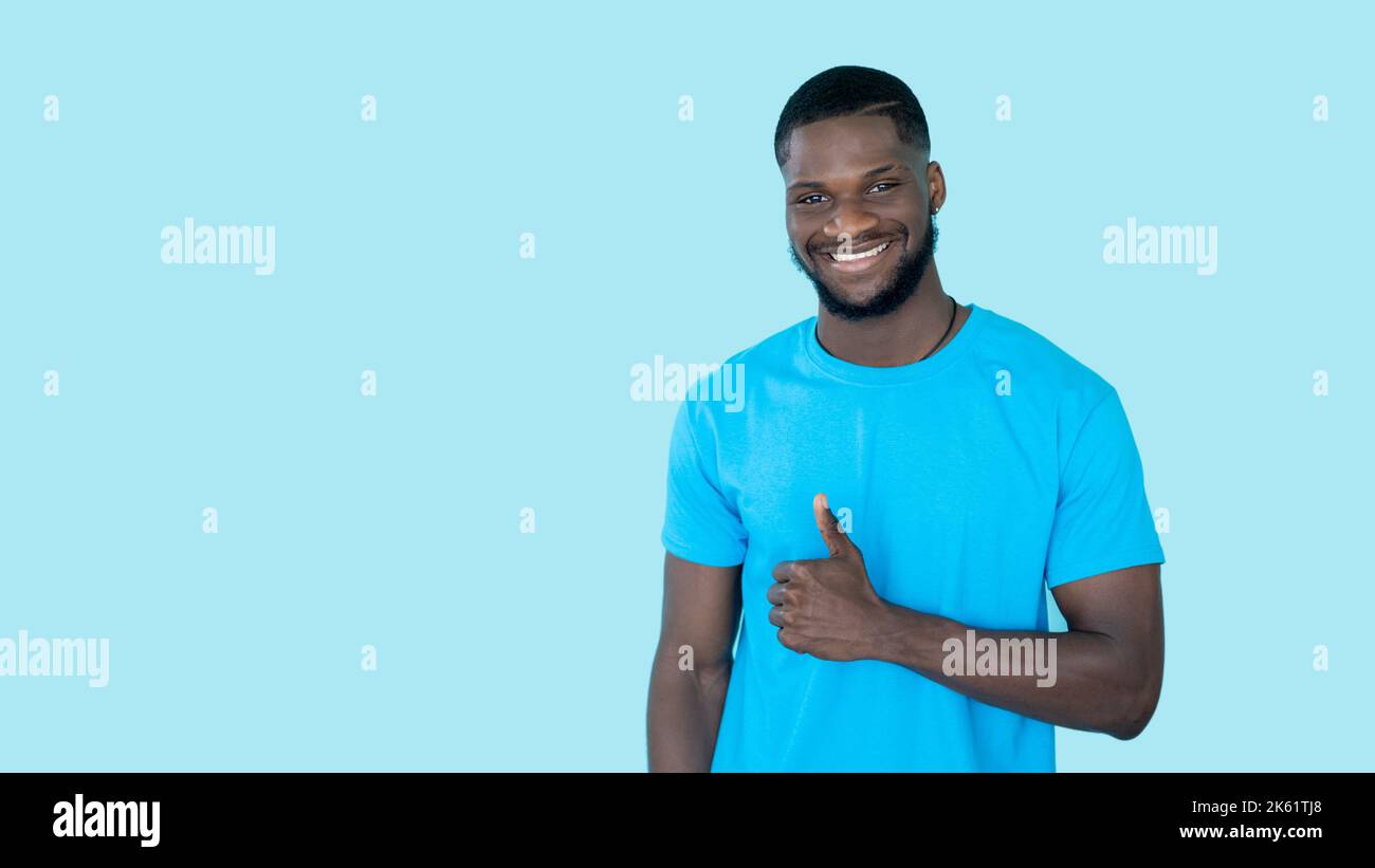 thumbs up agreement sign offer advertising man Stock Photo - Alamy