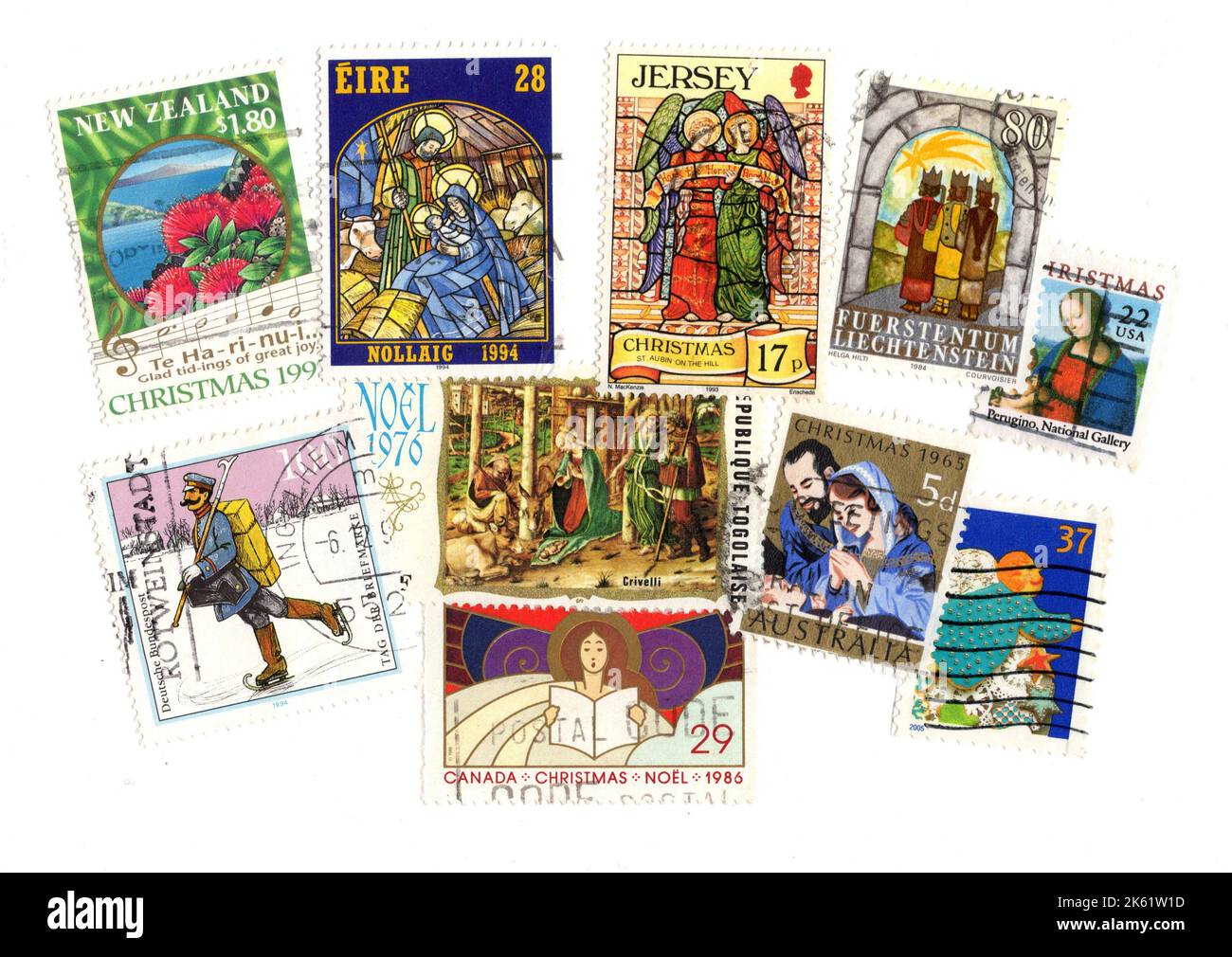 A montage of vintage Christmas stamps from around the world on a white background. Stock Photo