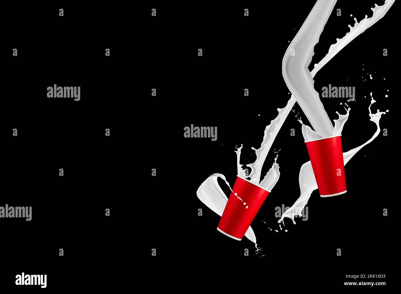 Paper cups with milk splashes on black background. Disposable cup with white milk splashes. Stock Photo