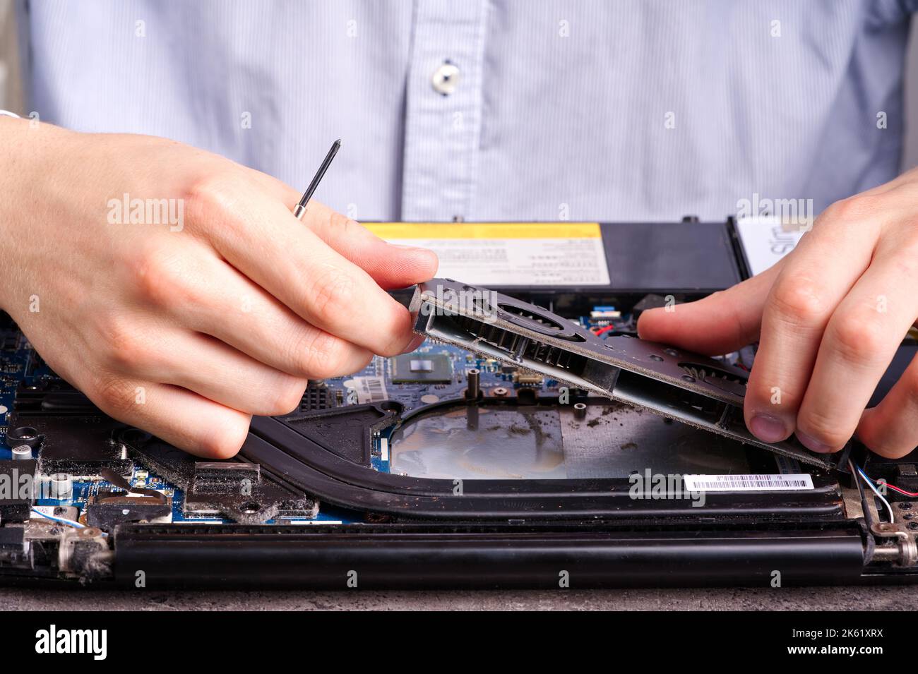 Hands fixing motherboard of pc or laptop notebook close up in service