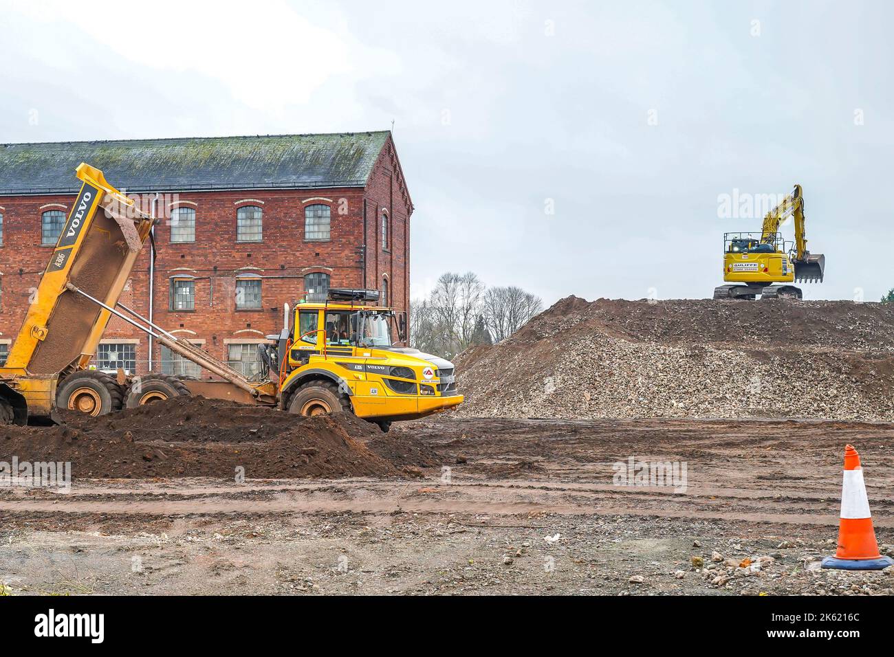Heavy construction equipment working in an urban rejuvenation project on a brownfield site. Stock Photo