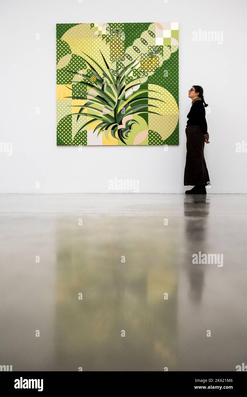 London, UK.  11 October 2022. A staff member with 'Pineapple', 2022, by Gabriel Orozco at the preview of ‘Diario de Plantas’, a new exhibition by artist Gabriel Orozco at White Cube, Mason’s Yard, in Mayfair.  The leaf print-inspired works began as entries in small notebooks during a period of time spent in Tokyo and Mexico City.  The exhibition runs 12 October to 12 November 2022. Credit: Stephen Chung / Alamy Live News Stock Photo