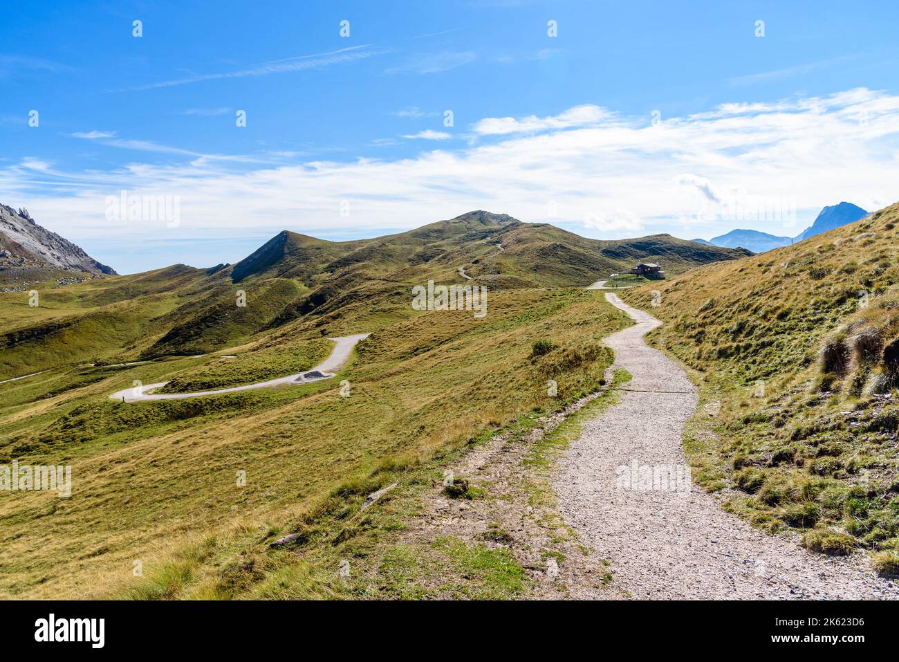 Deserted winding high altitute trail in the Alps on a clear autumn day Stock Photo