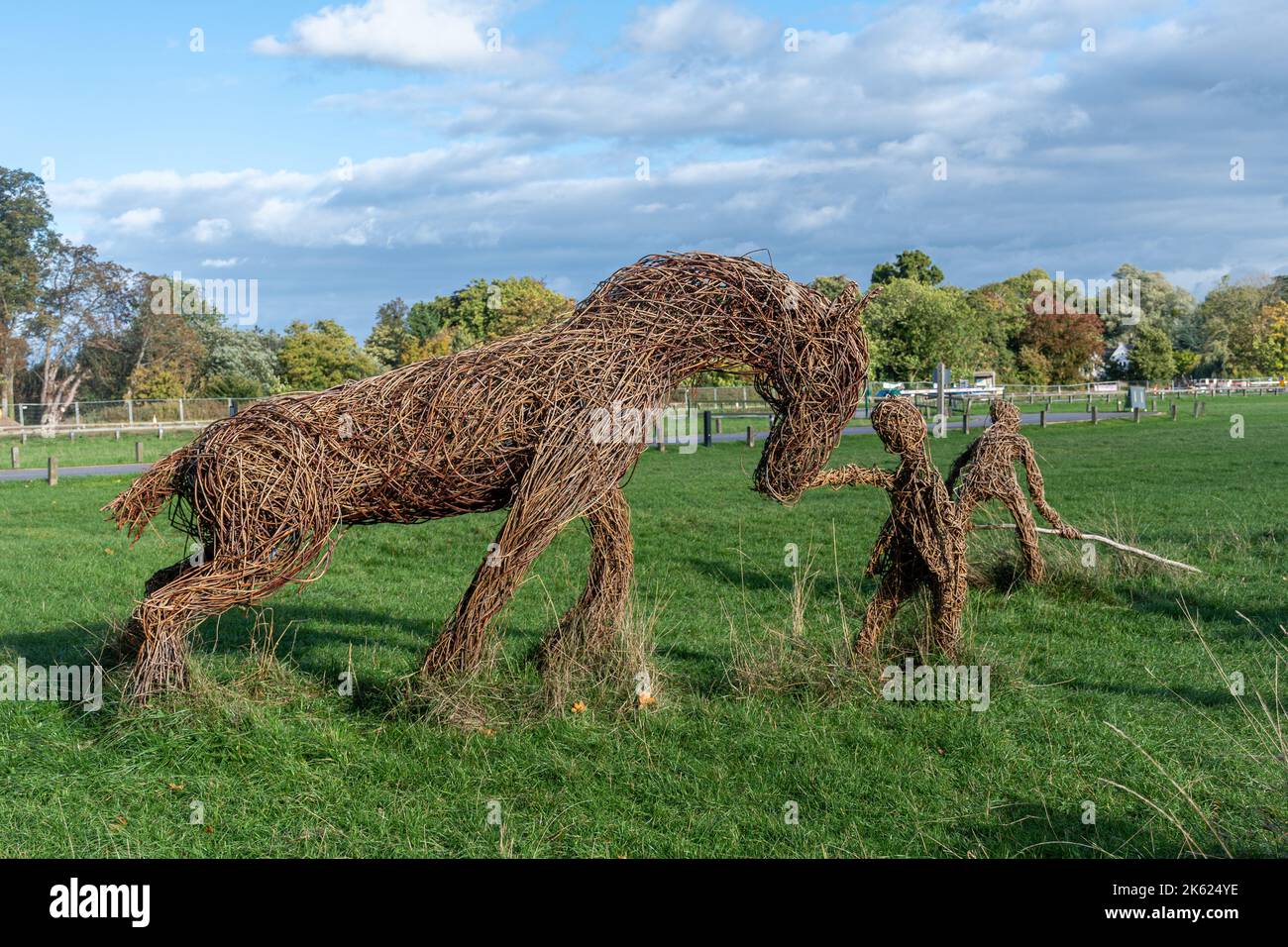 Haymaking, sculptures by Willow Twisters, on Runnymede meadows in Surrey, England, UK. Outdoor sculpture, artwork Stock Photo
