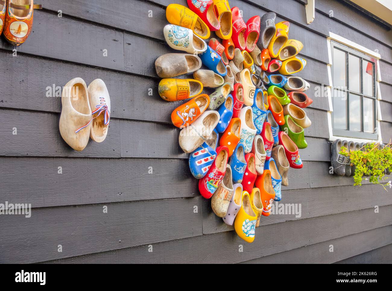 Netherlands. Rough background from gray boards. Many national Dutch Klomp shoes are nailed in the shape of a heart Stock Photo