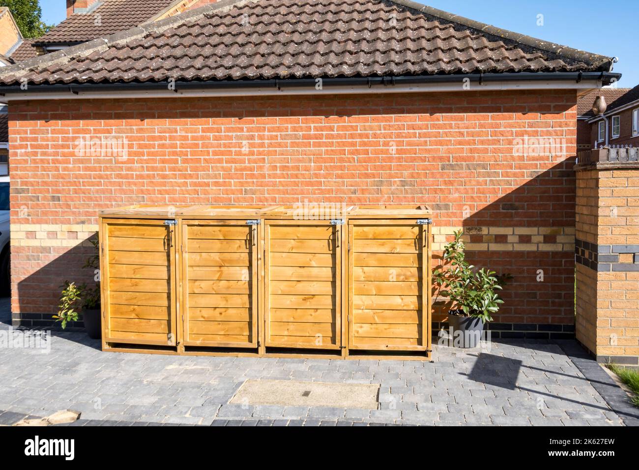 Wood cupboards housing waste bins, Lincolnshire 2022 Stock Photo