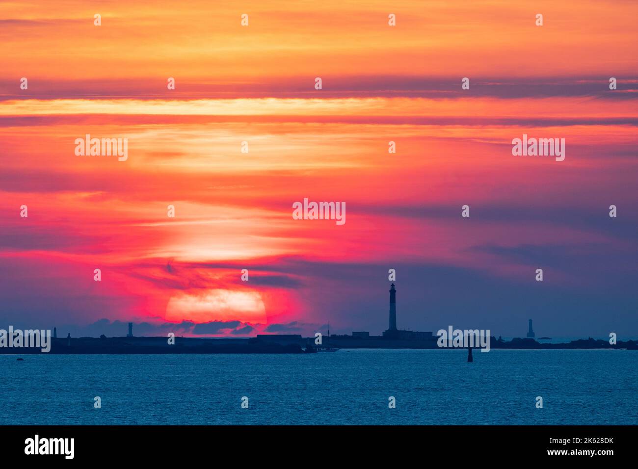 Warm colorful sunset over the Sein island in Brittany, France Stock Photo