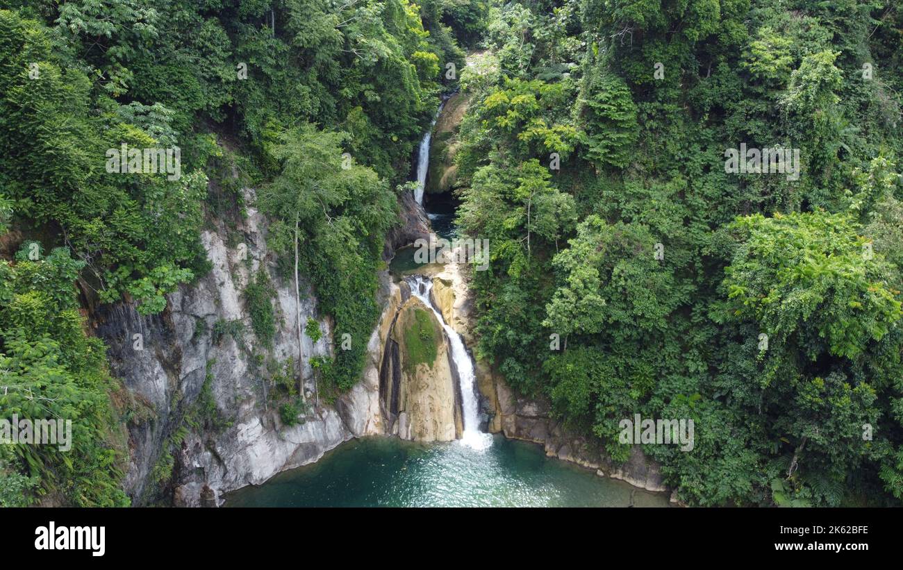 A view of the Magpong Falls flowing through the rocks in the greenery ...