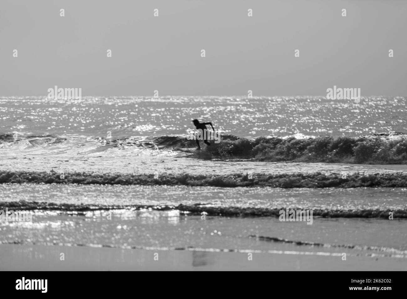 Person surfing on sea Black and White Stock Photos & Images - Alamy