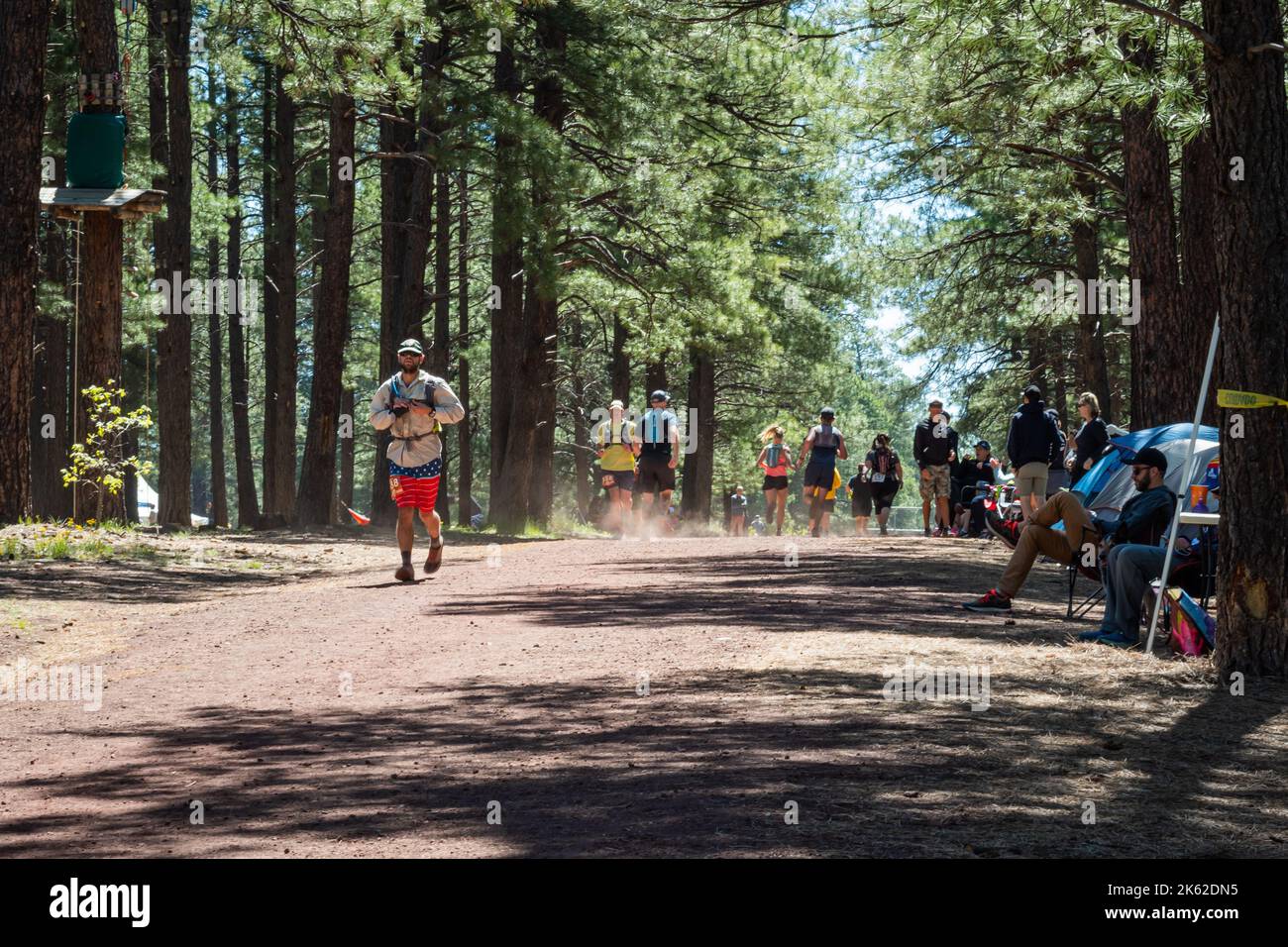 People running through the trail at Fort Tuthill County Park while