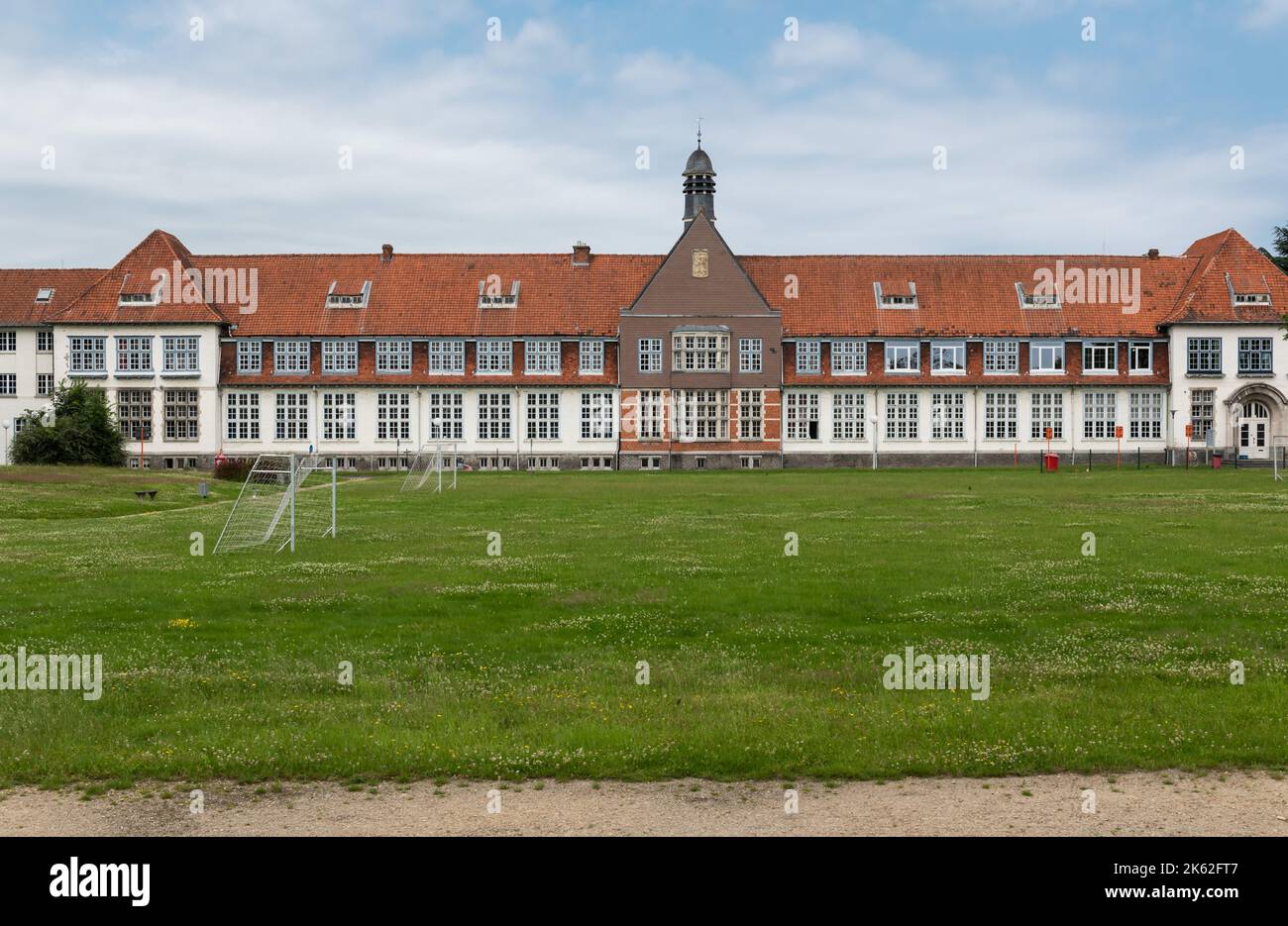 Wetteren, East Flanders Region, Belgium - 07 15 2021 Neo classical facade of a high school building Stock Photo