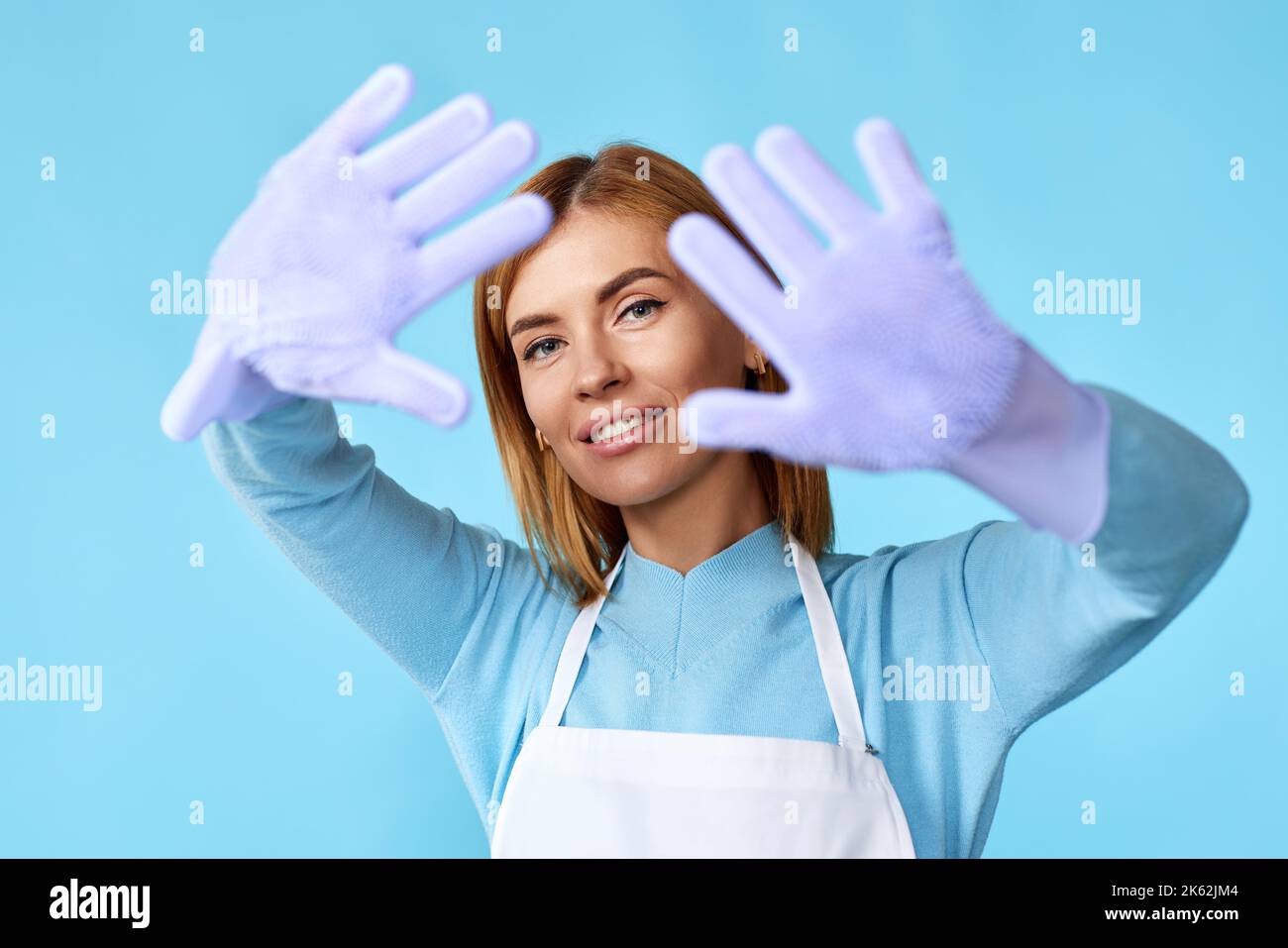 pretty woman in rubber gloves and cleaner apron Stock Photo - Alamy