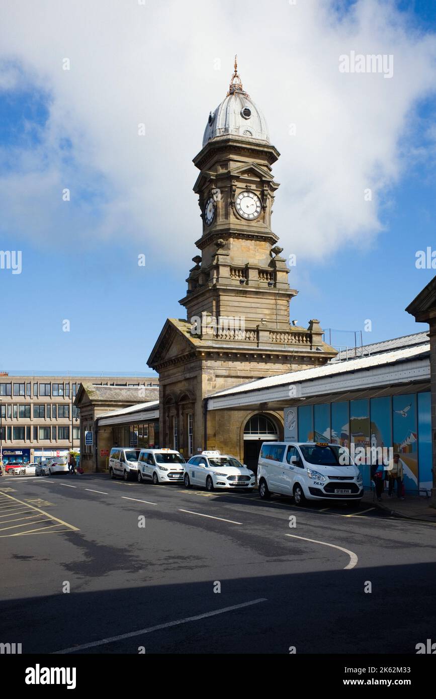 The clock tower of the Grade II listed railway terminus station at Scarborough, North Yorkshire Stock Photo