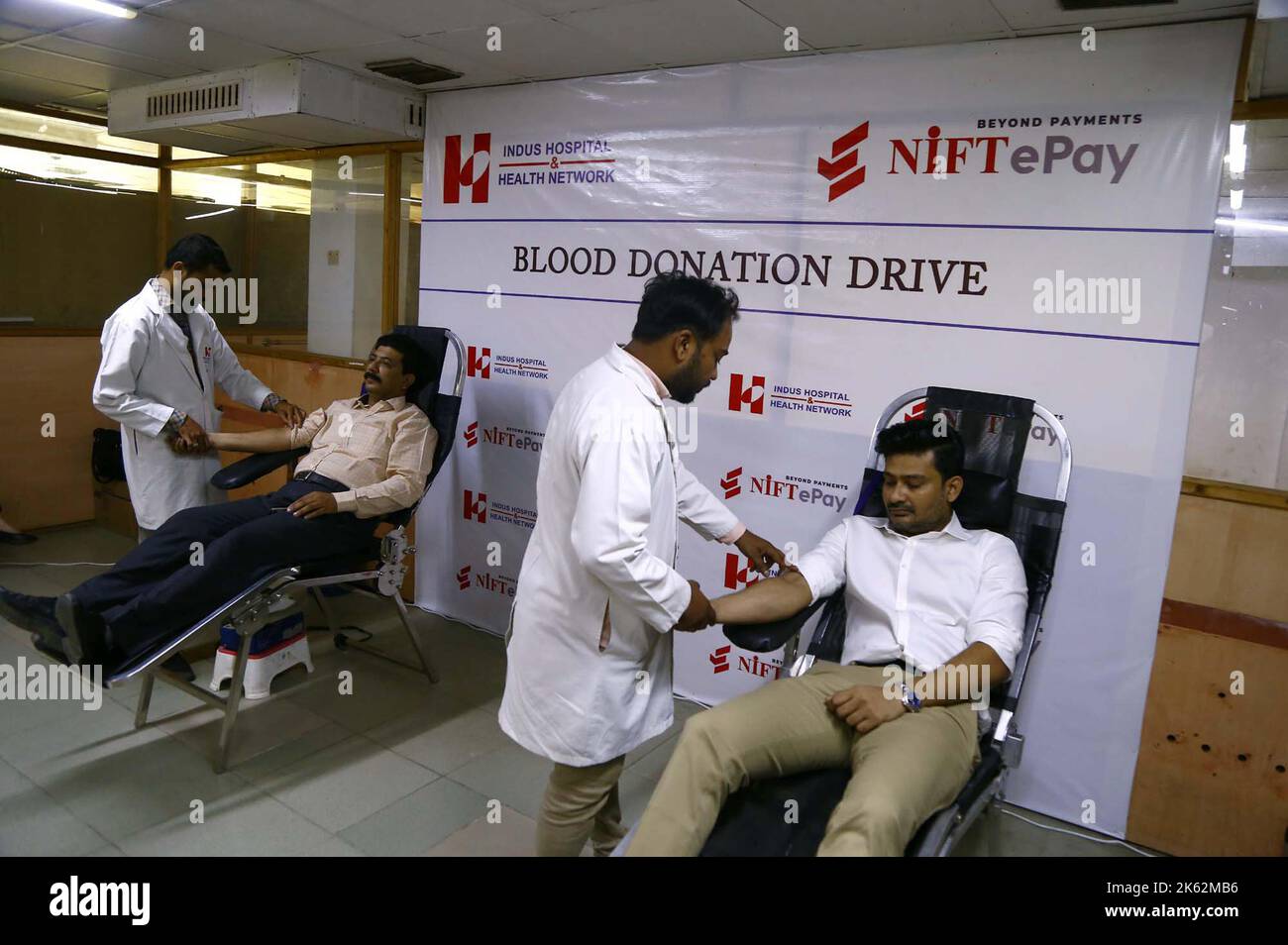 People are donating their blood at a blood donation camp organized by