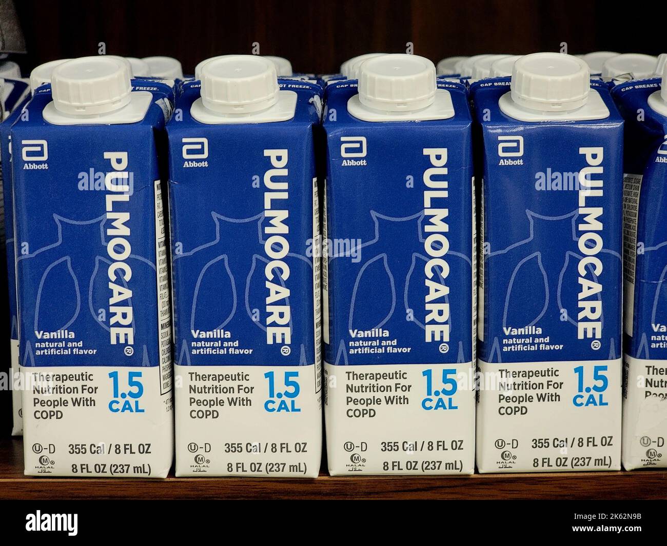 A row of plastic bottles of Pulmocare High Protein therapeutic