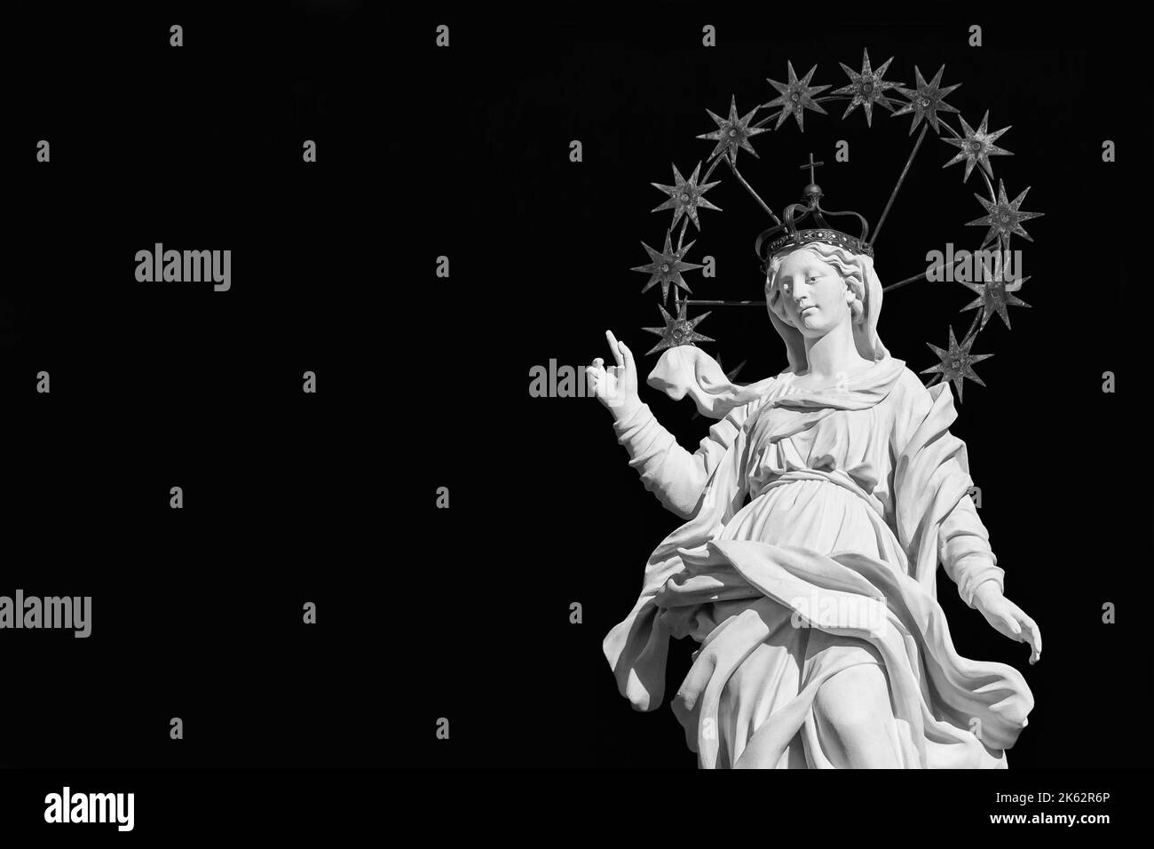 Virgin Mary of the Stars, old statue at the top of an ancient column in the historical center of Lucca, erected in 1687 (Black and White with copy spa Stock Photo