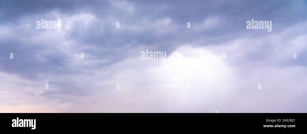 Dramatic sky background. Stormy clouds in dark sky. Moody cloudscape Stock Photo