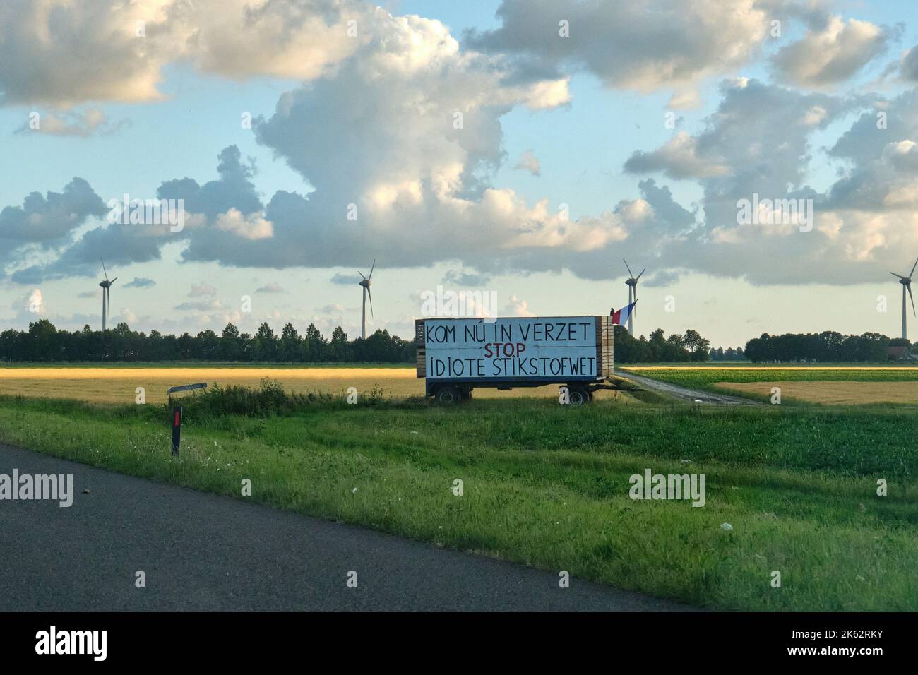 Banner next to highway with text 'Now resist, stop idiotic nitrogen law' Dutch farmers protest against the plans of the government forced shrinking of Stock Photo