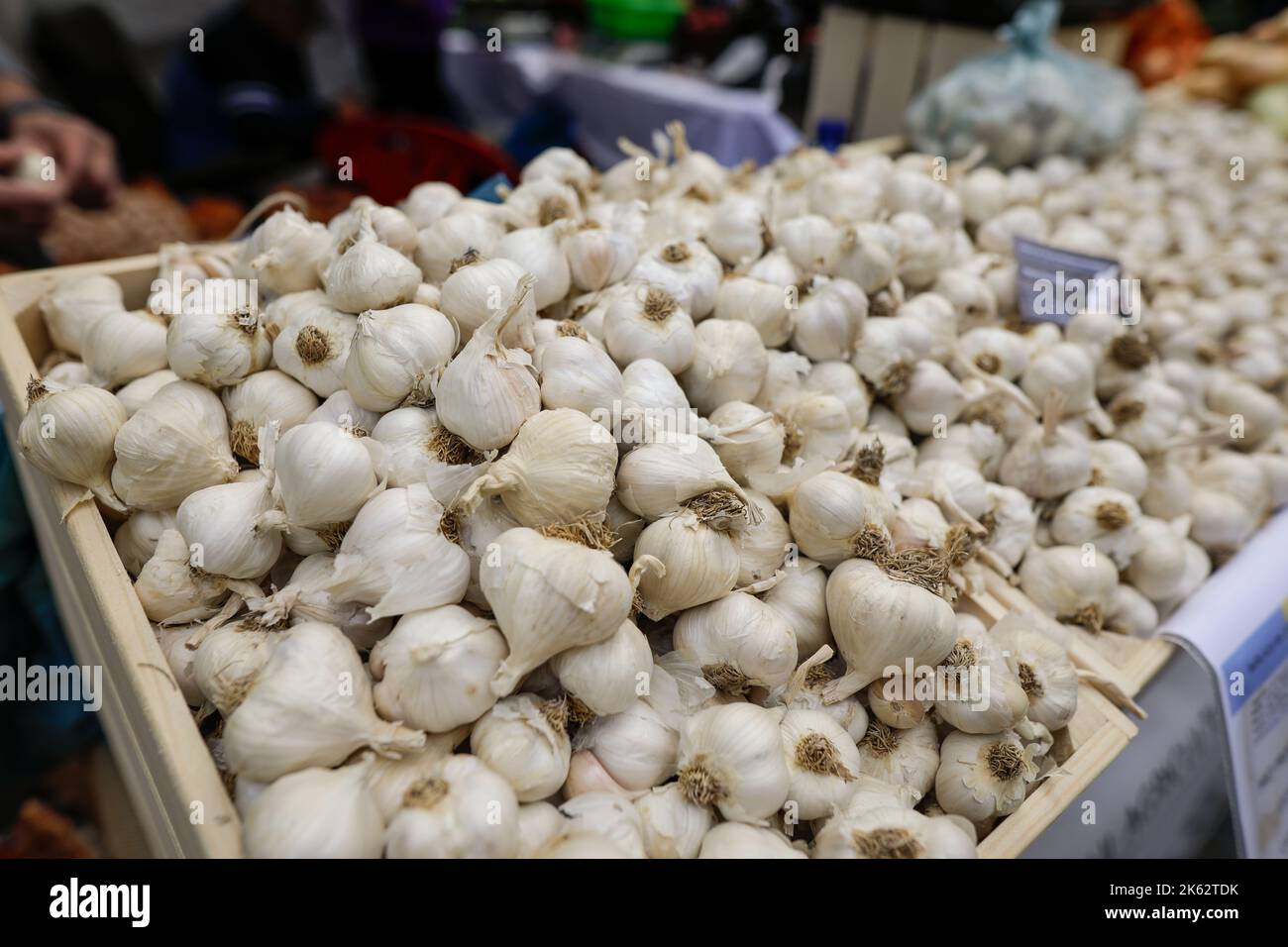 Shallow depth of field (selective focus) details with dried garlic in an european farmers market. Stock Photo