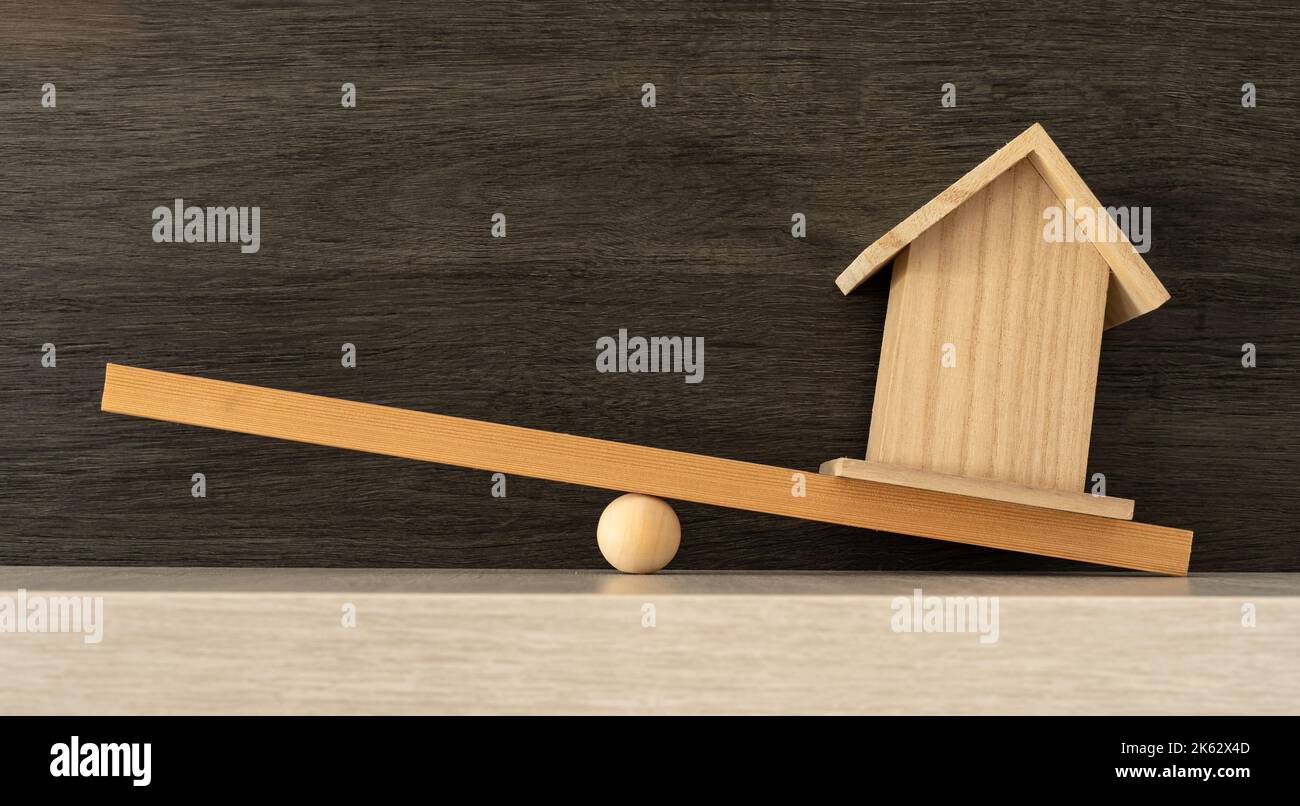 Problematic concept of the great weight of housing. Wooden house on one