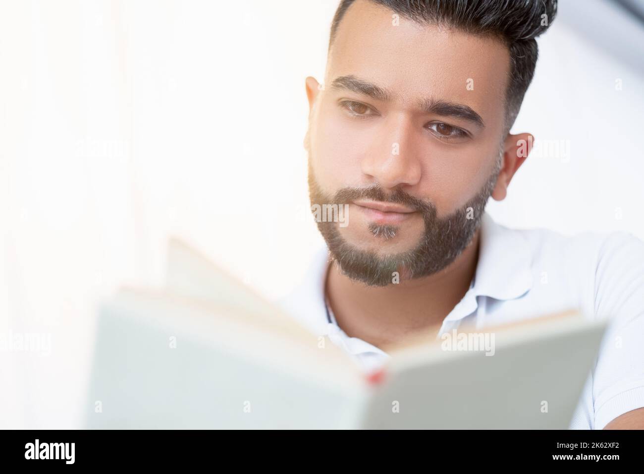 interesting book involved man enjoying time Stock Photo