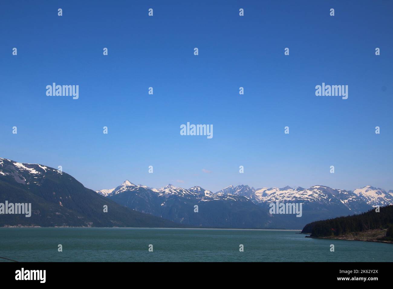 View of mountainous shoreline in Chilkoot Inlet, Alaska Stock Photo