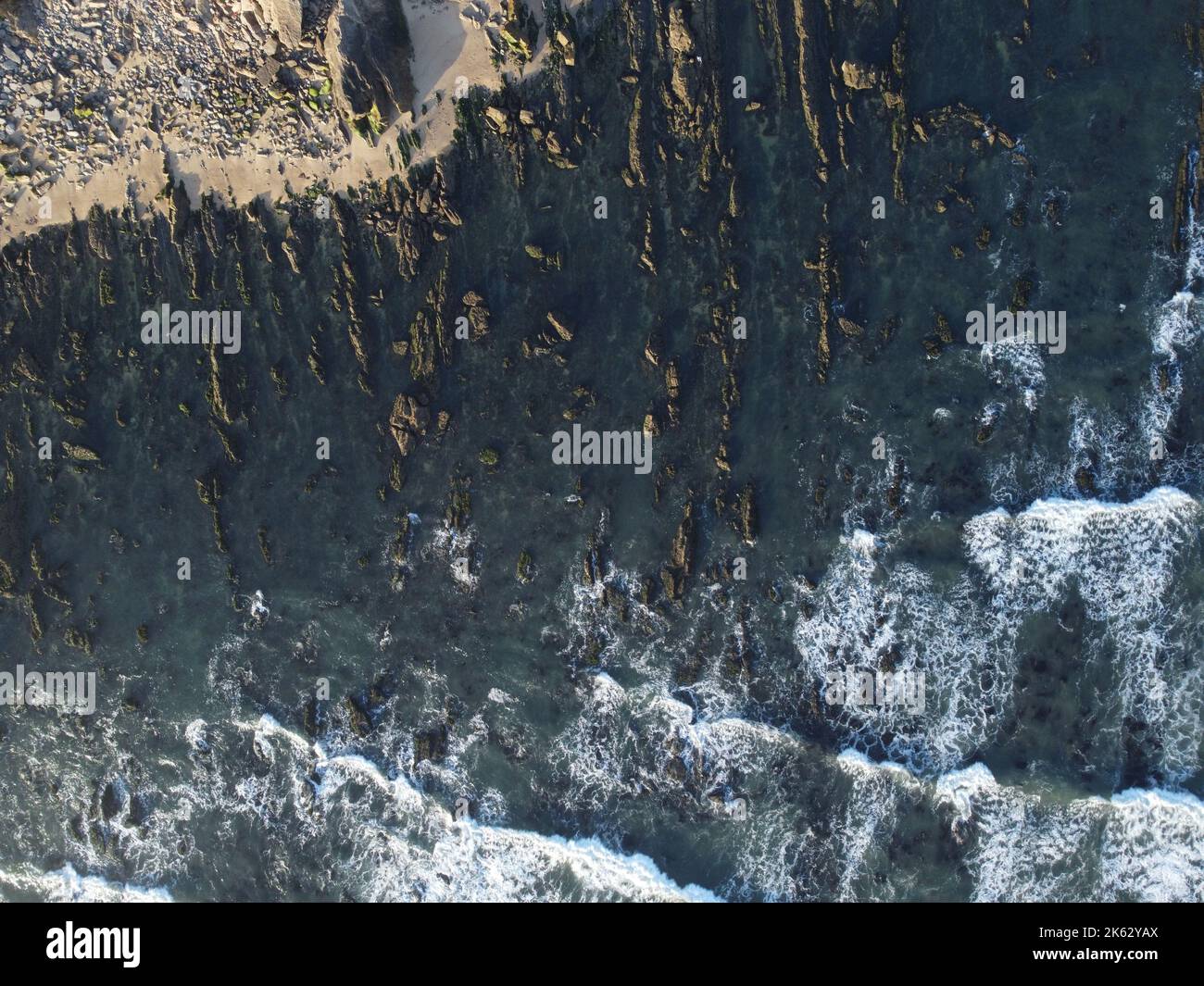 A bird's eye view of waves and the beach Stock Photo - Alamy