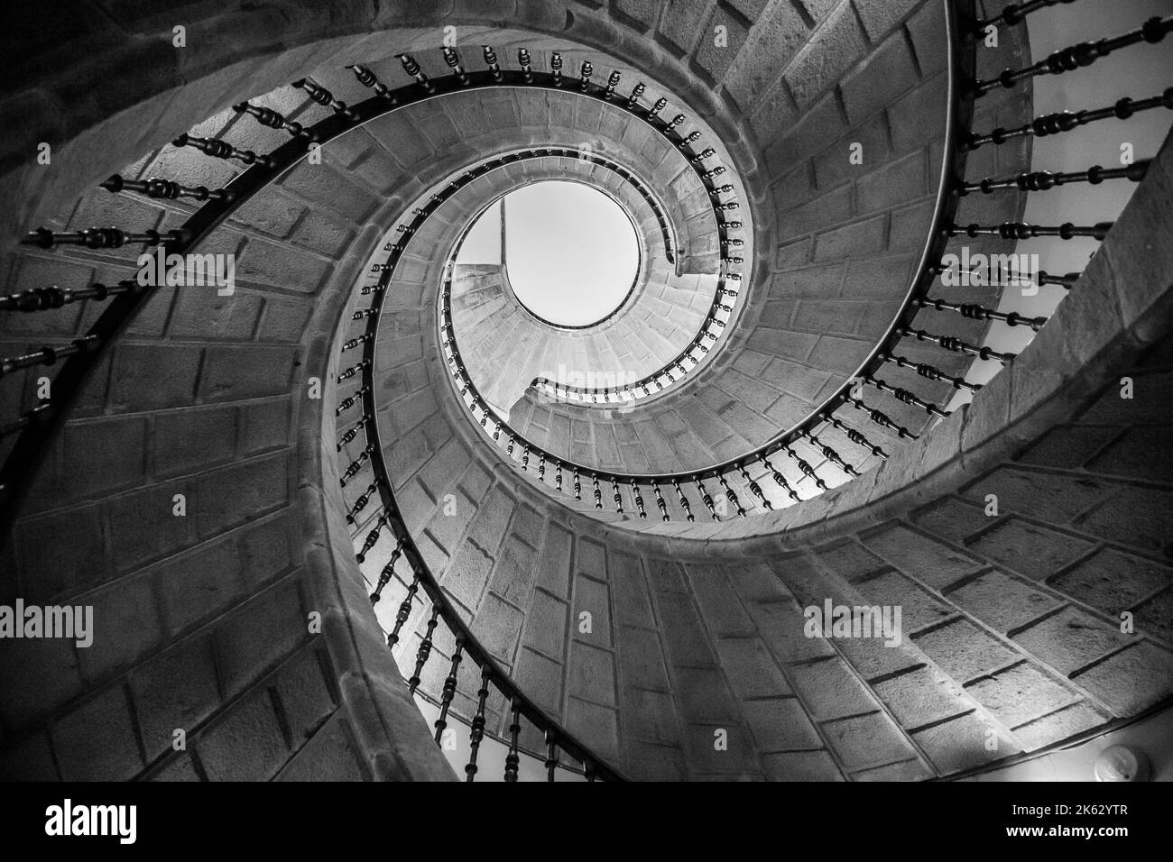 interior circular stone staircase, elaborate and decorative architectural details Stock Photo